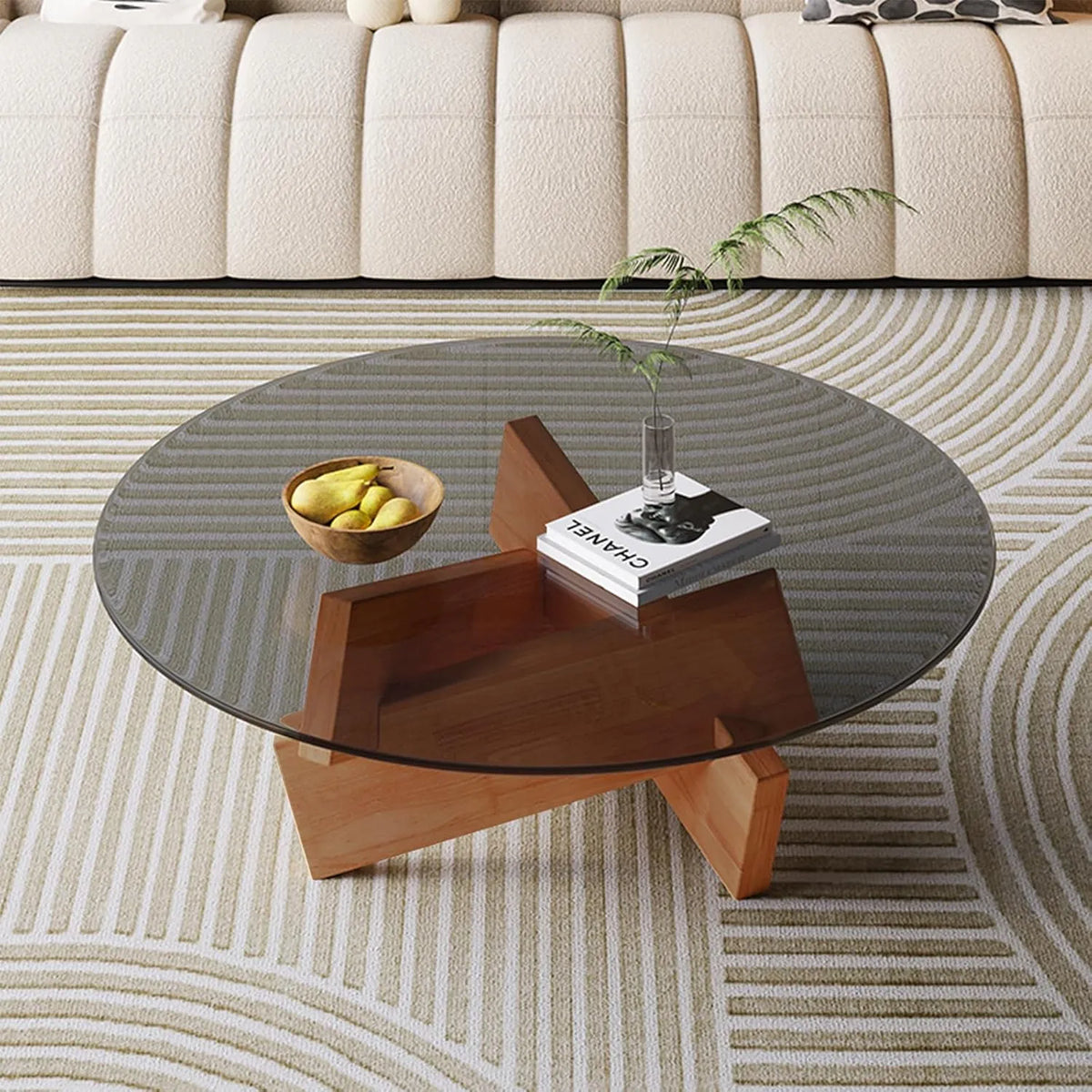 Table basse en verre rond avec piètement croisé en bois, design moderne pour salon et chambre